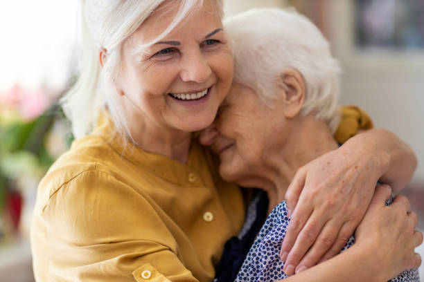 01_elderly_daughter_hugging_elderly_woman-1